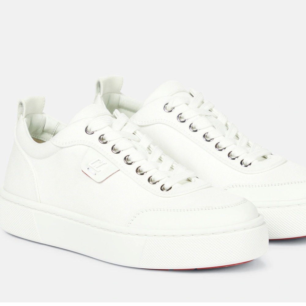 CHRISTIAN LOUBOUTIN
Simplerui logo-detailed leather-trimmed canvas sneakers